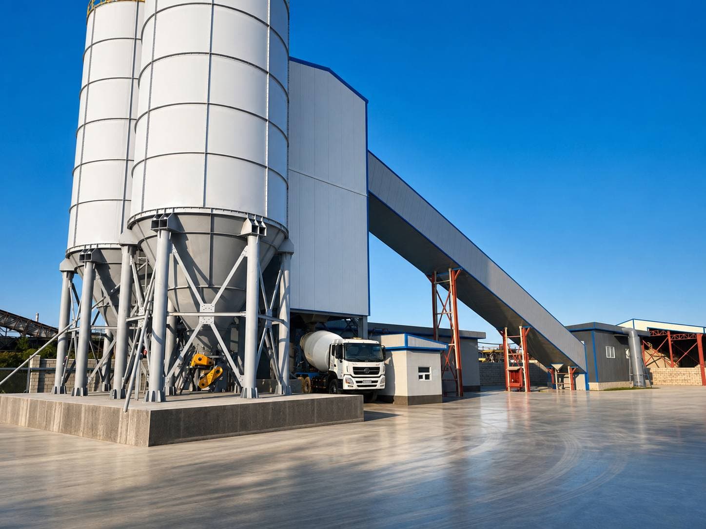KONAEV BETON 1 concrete plant — cement silos and the batching tower at sunset
